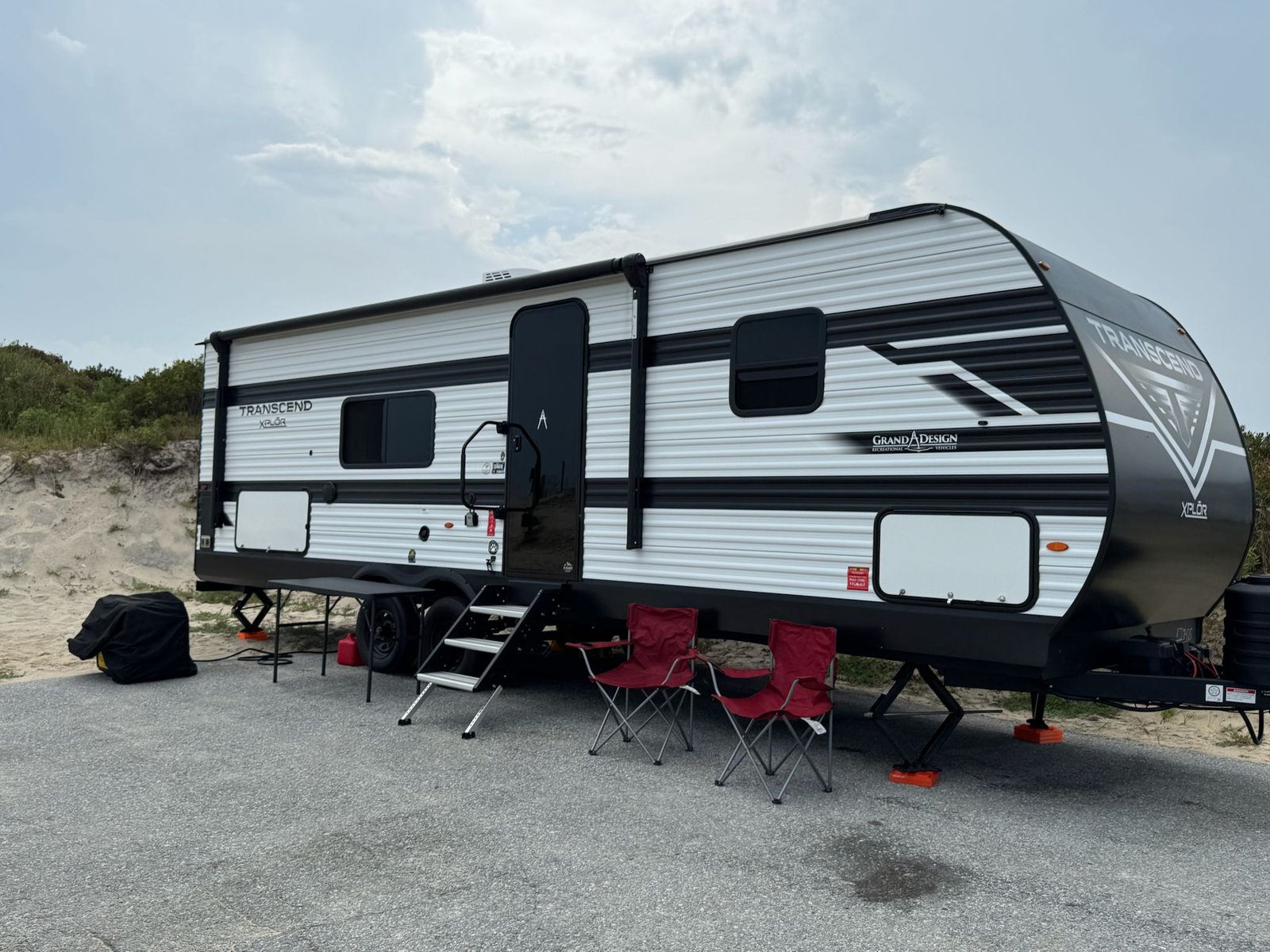 2026 grand design transcend xplor 26bhx exterior view with tables at assateague island Ocean City
