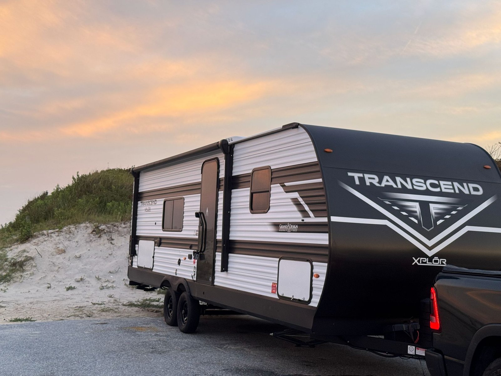 2026 grand design transcend xplor 26bhx exterior view with truck at assateague island Ocean City